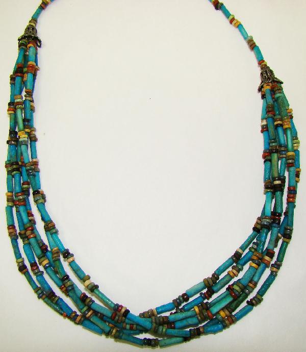 Egypt, wearable "mummy" bead necklace: Egypt, Late Period, 20th-30th Dynasties, 715-332BC., an attractive and wearable 6 strand "mummy bead" necklace consisting of short darker blue tubular and small multi-colored faience beads that lead t