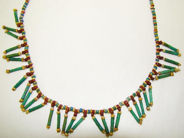 Egypt, Late Period, wearable "mummy" bead necklace: Egypt, Late Period, 20th-30th Dynasties, 715-332BC., an attractive and wearable "mummy bead" necklace consisting of fine and small blue-green and red faience beads that is highlighted with 32 separate