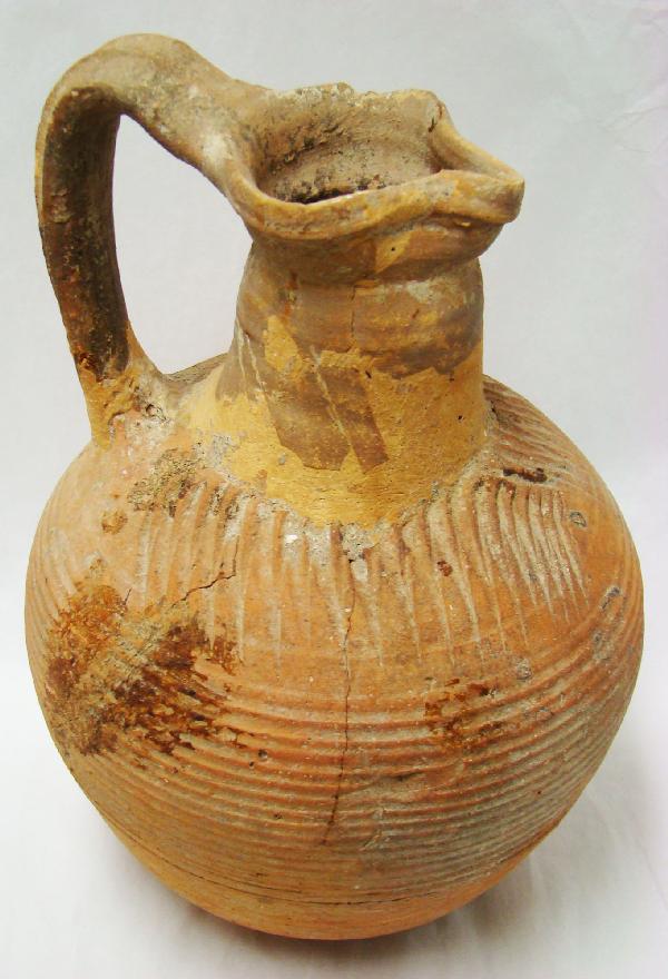 Late Roman-Byzantine, large large TC pitcher: Late Roman-Byzantine, c. 500-900AD., a nice earth toned large terra cotta pitcher with trefoil spout. Most of the round body of vessel with nicely incised fine horizontal linear design. Age cracks, re