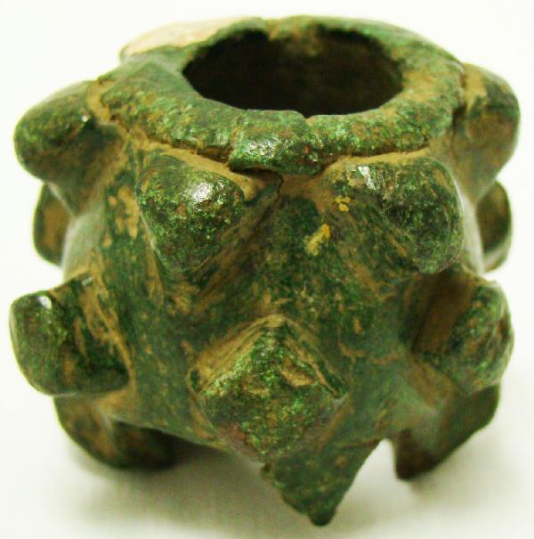 Persia, Luristan, a finely made small bronze mace: Persia, Luristan, c. 1200BC., a finely made bronze mace head. Cast in one piece cylinder with pyramidal spikes, rhomboidal in cross section, through hole of a conical shape. Finial of this type must b