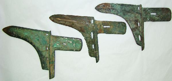 China, 3 fine bronze dagger axes or "Ko": China, The Warring States, c. 475-221BC., a lot of 3 bronze dagger axes or "Ko". Patenated from burial. One piece still with traces of plating. All 3 of these are likely burial pieces. S: 6.5", 7 1/8"