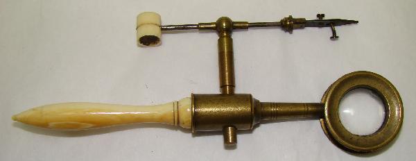 England, a charming "flea" microscope: England, c. early 19th century, a charming "flea" microscope with ornate handle. In choice condition. Charlotte Collection. 4.5". Rare.