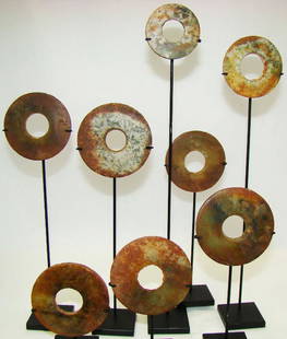 Burma, circa 100 BC – 100 BC. 8 Archaic Jade Discs: Burma, circa 100 BC – 100 BC. 8 Archaic Jade Discs – Ancient Shan culture, Dark green jade with red oxidation adhered from the iron-rich soil in which they were found. 8 individual pieces of vario