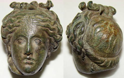 Roman, an exquisite small bronze steelyard weight: Roman, c. 100-300AD., an exquisite small bronze steelyard weight, 111.3 grams. Holed where either wire or hemp cord would have been tied as part of hair style. A female head with wonderful and realist