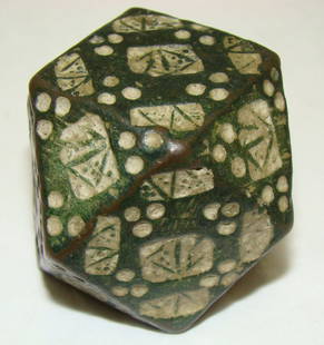 Byzantine, choice bronze dodecahedron weight: Byzantine, c. 800-1000AD., a choice bronze dodecahedron weight with interesting punch mark designs throughout. Nice dark green patina with pale green highlighting within punch marks. About 3.5cm squar