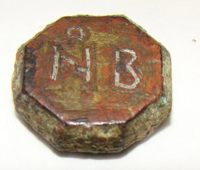 Byzantine, a small silver etched bronze weight: Byzantine, 800-1000AD., a small octagonal bronze weight. 8.8 grams, size is 5/8" in diameter. Etched in silver on top are the letters NB. Nice. Paul Bessey Collection.