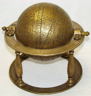 Persia, a fine small brass astronomical globe: Persia, Qajar Period, 1794-1925, a small brass astronomical globe. Globe with incised decorative constellations throughout sits on elevated 4 legged double circular disc stand. Globe spins freely. Hei