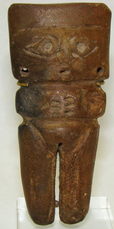Colombia, Quimbaya, miniature ceramic standing man: Colombia, Quimbaya, c. 500-1000AD., a miniature ceramic standing man in pale brown colored slip with his arms held across his chest. Typical large and square shaped head with large round eyes and 2 pi