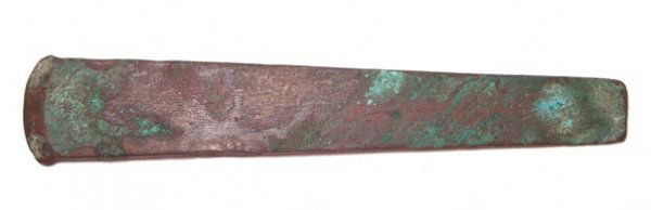Rare Pre-Dynastic Copper Adze Blade.: Egypt, Pre-Dynastic Period, c.3100 – 3000 BC. A nice copper adze blade with sharpened end and nice red. Brown and green patination. L: 7 1/8". See Petrie, Tools and Weapons, pl. XVI, nos. 64. Ex Lei