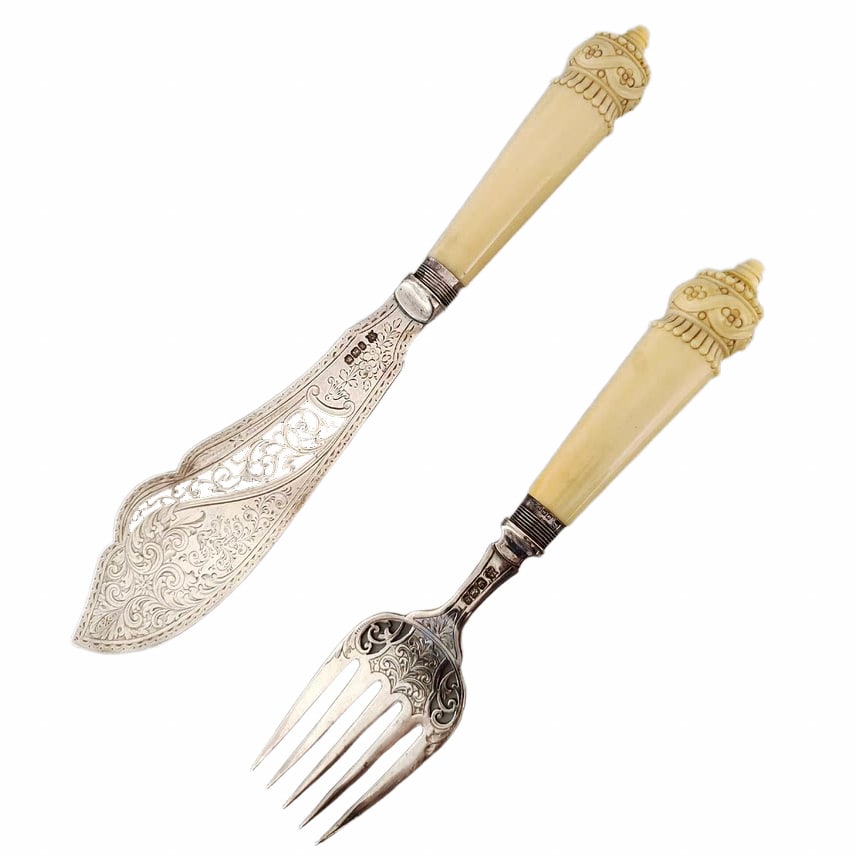 19TH CENTURY EUROPEAN ANTIQUE OVERSIZED STERLING SILVER CARVING KNIFE AND FORK SET: Knife: L: 12 5/16 in (31.3 cm); Fork: L: 9 7/16 in (24 cm); Weight: 326 g, 1894 British Antique Sterling Silver Carving Knife and Fork Set with hallmarks. All sold 'as is,’. The absence of a conditi