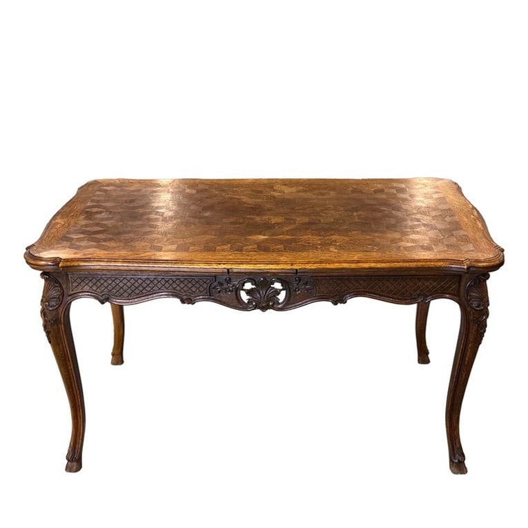 LOUIS XV STYLE FRENCH OAK CARVED DINING TABLE: Dimensions: L: 4 15/16 ft (150 cm); W: 3 7/32 ft (98 cm); Extended Length: 8 7/32 ft (2.5 m), French Oak Queen Anne Dining Table. Parquet design with extension leaves. All sold 'as is,’. The absence