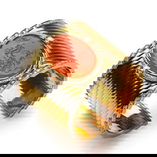 GOLD AND CARNELIAN CUFF BRACELET WITH DIAMONDS, SIGNED D.S. & A.: Dimensions: Interior diameter: 2 3/16 in. (55.3 mm) Weight: 125.3 g A bold and striking wide cuff bracelet crafted in polished fluted gold, centering a finely carved oval carnelian intaglio depicting