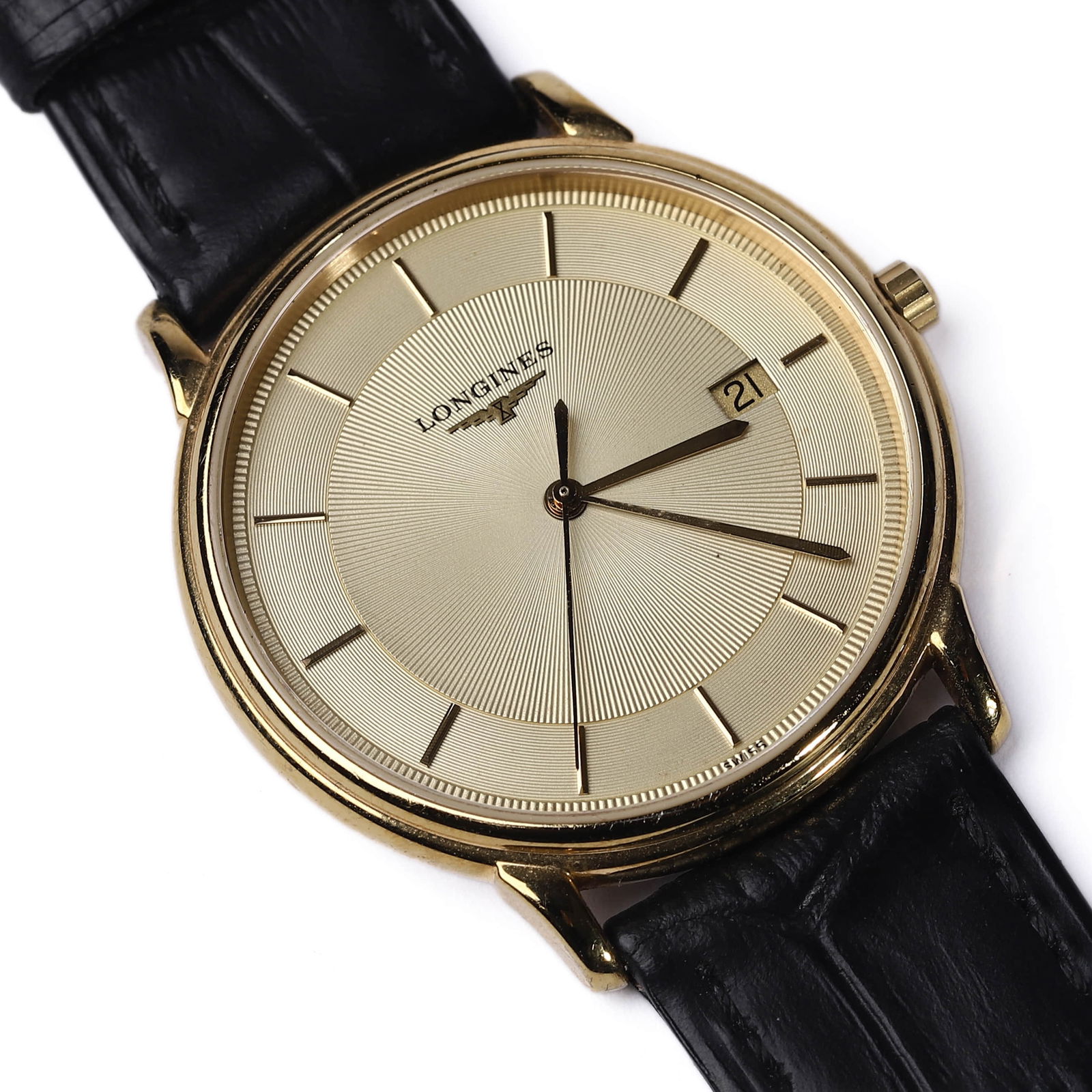 LONGINES GOLD-PLATED STAINLESS STEEL WRISTWATCH WITH DATE DISPLAY, CIRCA 2000: Dial Diameter: 13 3/16 in. (33.5 cm) Total Length: 9 1/4 in. (23.5 cm) This Longines wristwatch, part of the "Les Grandes Classiques" collection, features a refined gold-plated stainless steel case wi