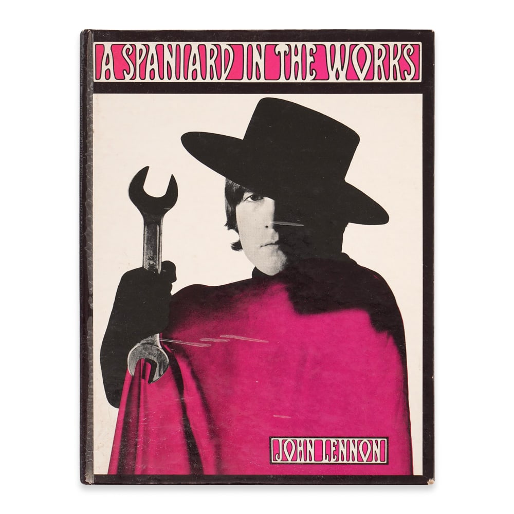JOHN LENNON SIGNED A SPANIARD IN THE WORKS BOOK: 7 1/8 x 5 1/2 in (18 x 14 cm) Provenance and Authentication: This collectible has undergone a rigorous forensic evaluation. The signatures were carefully analyzed across multiple criteria, including