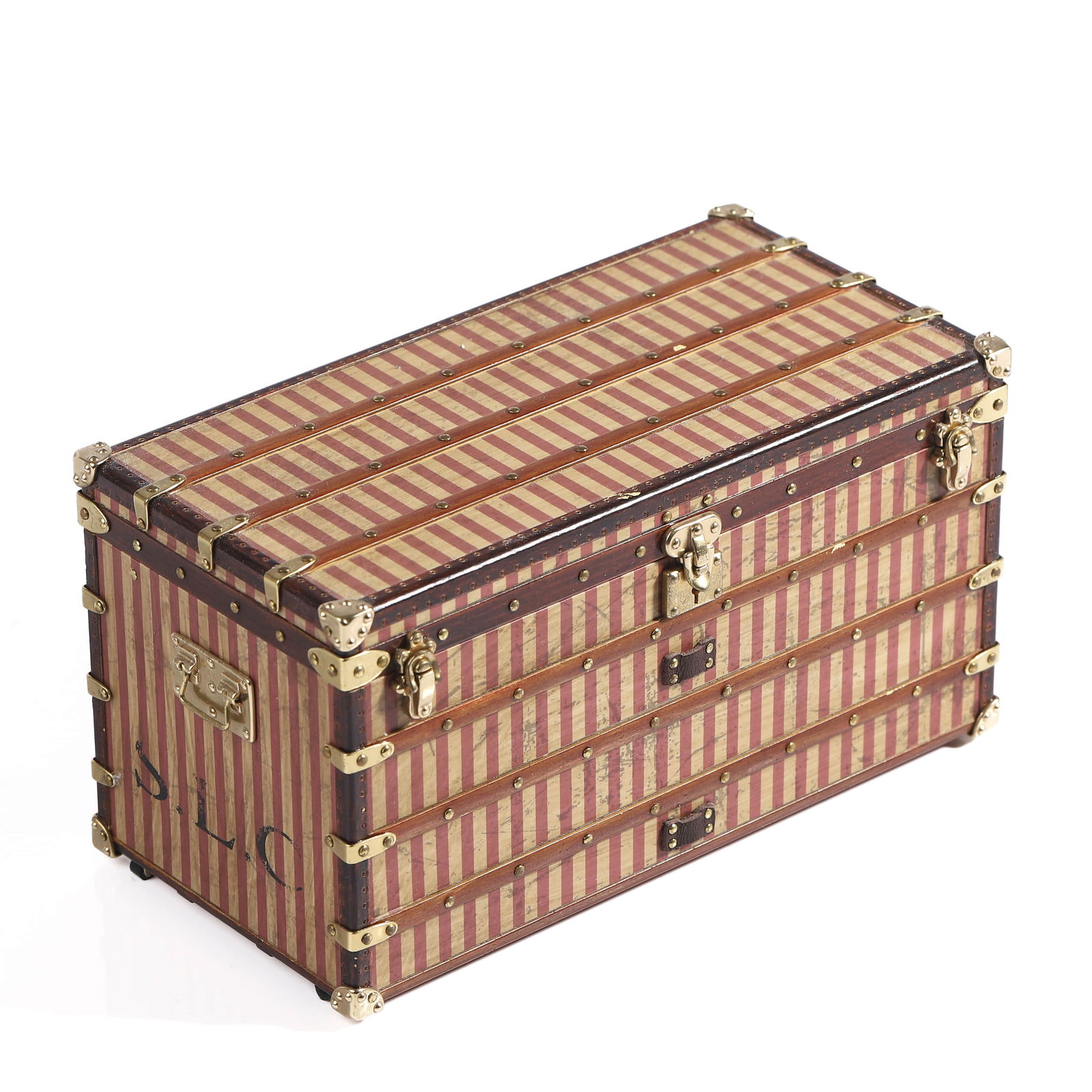 A LOUIS VUITTON MINIATURE STEAMER TRUNK: Dimensions Length: 5 11/16 in (14.5 cm); Width: 2 3/4 in (7 cm); Height: 2 15/16 in (7.5 cm) Description A finely crafted Louis Vuitton miniature steamer trunk modeled after the Maison’s early