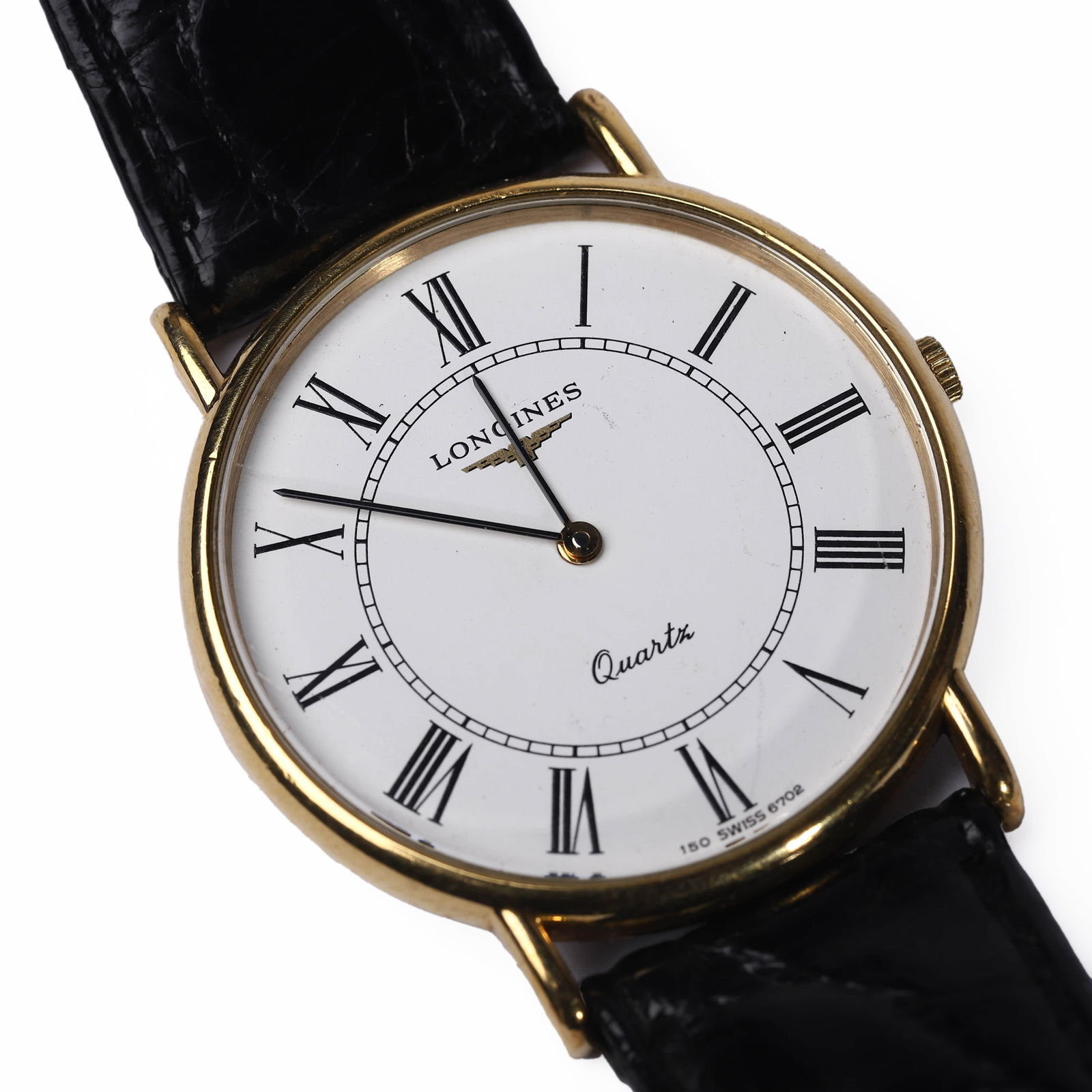 LONGINES QUARTZ WRISTWATCH WITH ROMAN NUMERALS AND LEATHER STRAP: Dimensions: Dial Diameter: 33.5 mm, Overall Length: 9 1/4 in. (23.5 cm) This elegant Longines wristwatch features a gold-tone round case with Roman numeral hour markers and classic black hands. The
