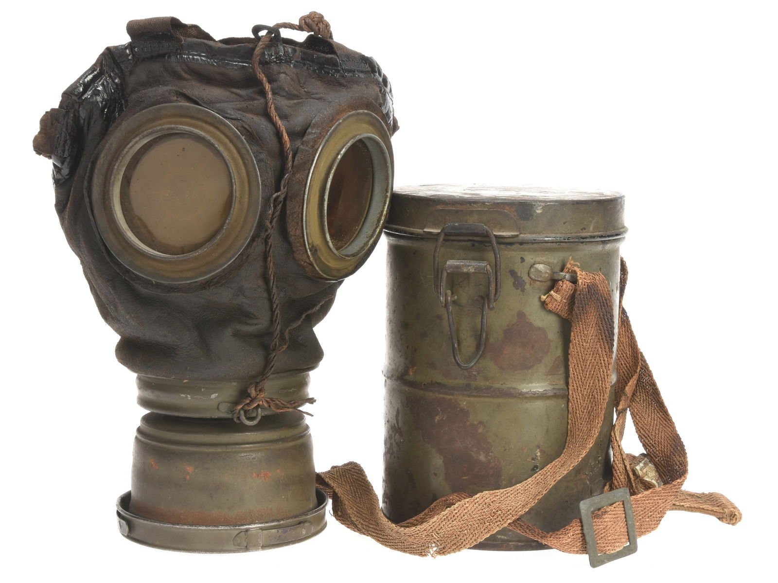 Imperial German M1917 Lederschutzmaske Gas Mask And Carrier: Imperial German M1917 Lederschutzmaske Gas Mask And Carrier M17 lederschutzmaske in nice pliable condition has complete head harness, neck strap, and filter. The filter has a few rust spots, but not t