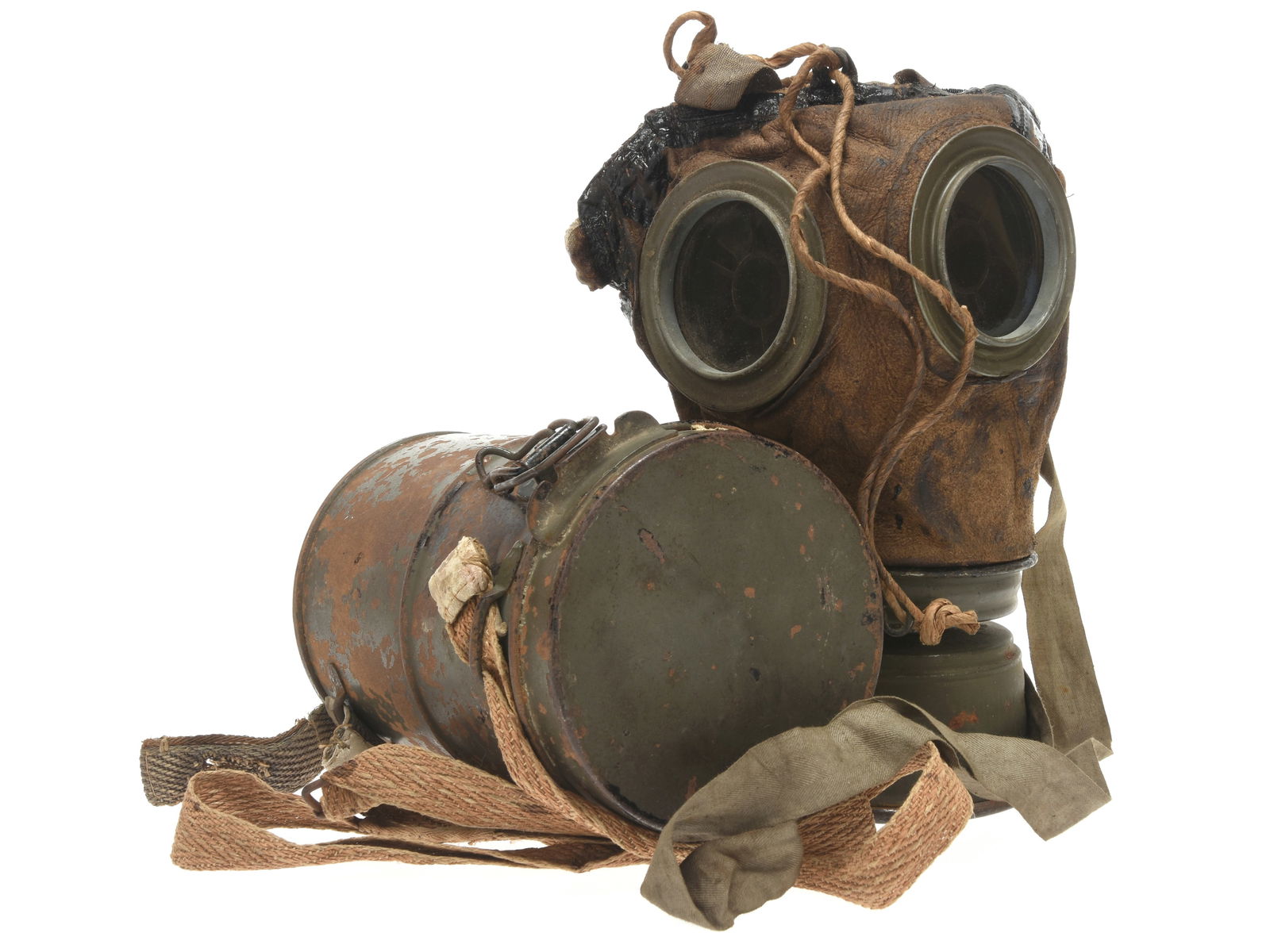 Imperial German M1917 Lederschutzmaske Gas Mask And Carrier: Imperial German M1917 Lederschutzmaske Gas Mask And Carrier M17 lederschutzmaske in nice pliable condition has complete head harness, neck strap, and filter. The filter has a bit of light rust but rem