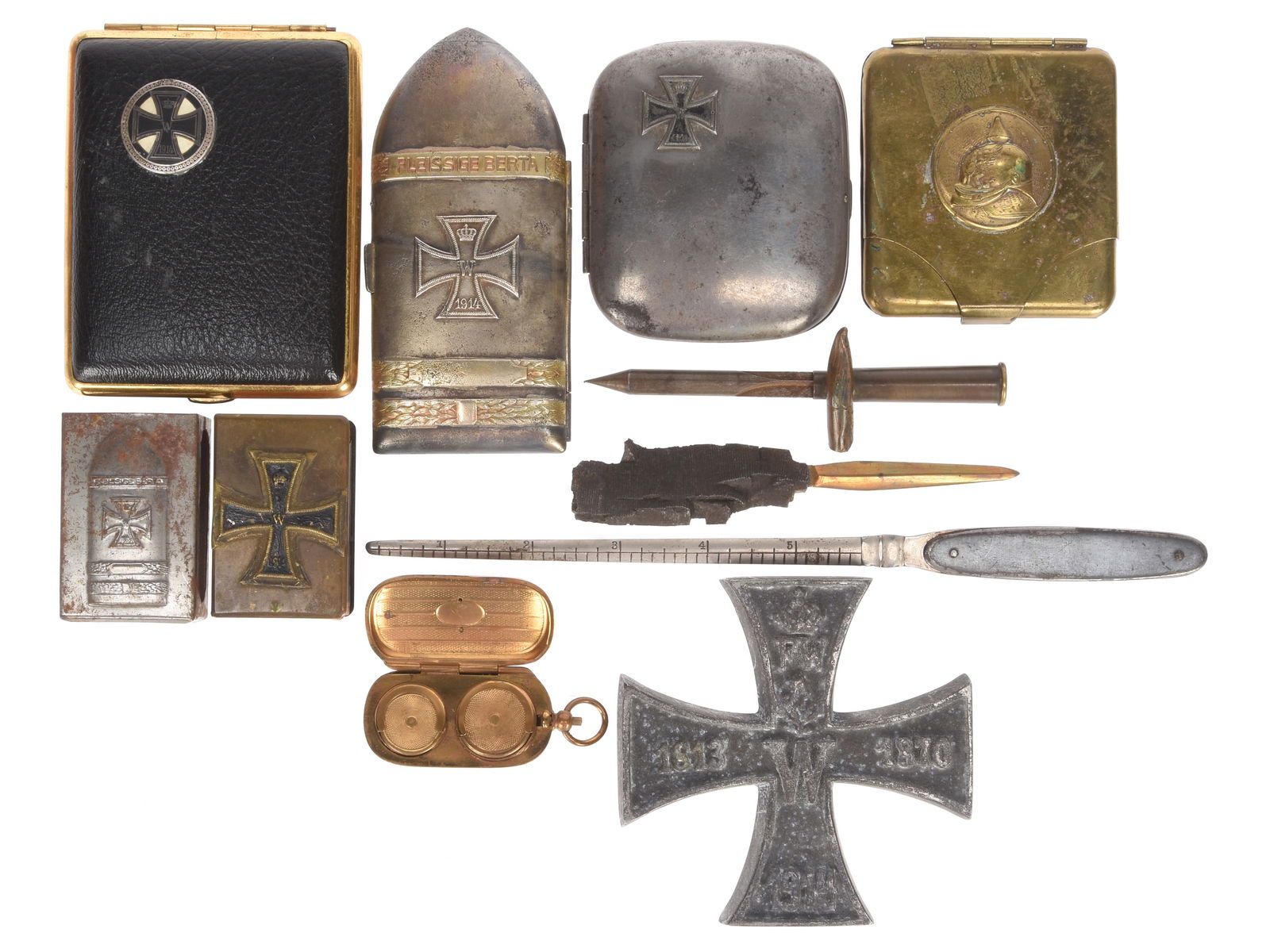 Imperial German Motif WWI Souvenir Lot: Cigarette Cases, Letter Openers, Match Safes & More: Imperial German Motif WWI Souvenir Lot: Cigarette Cases, Letter Openers, Match Safes & More Eleven items total. Includes four cigarette cases with Iron Cross, spike helmet, or artillery shell motifs,