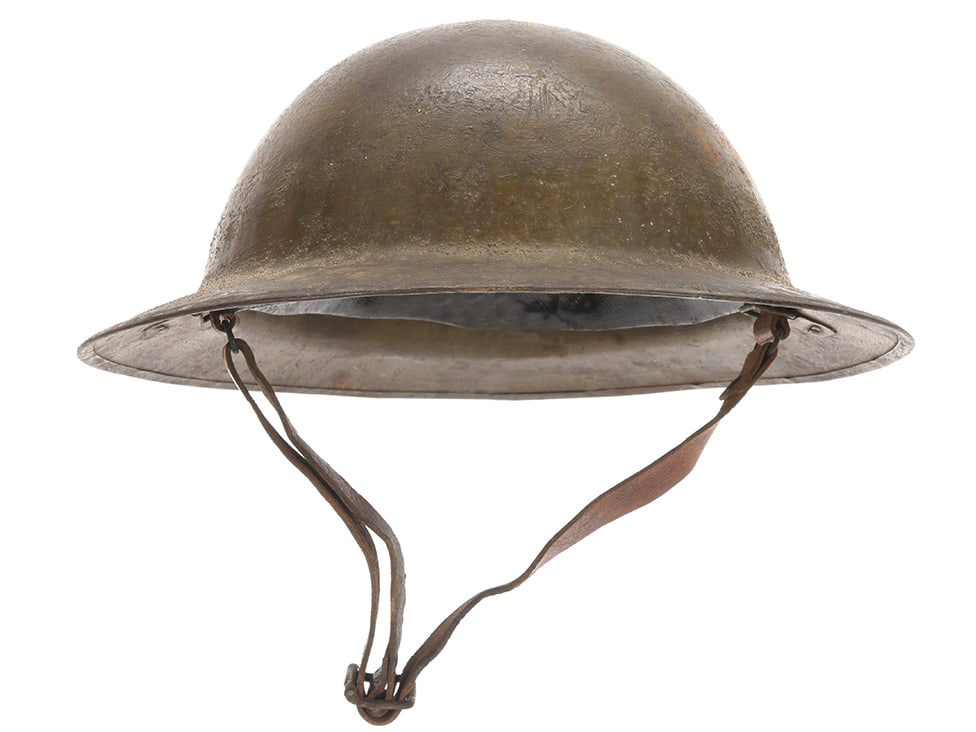 British WWI Steel Helmet: British WWI Steel Helmet A nice example, has 80%+ olive finish. Interior has an excellent, intact third pattern liner with gray felt crown pad and a nice condition chinstrap. Lacks only the paper tag.