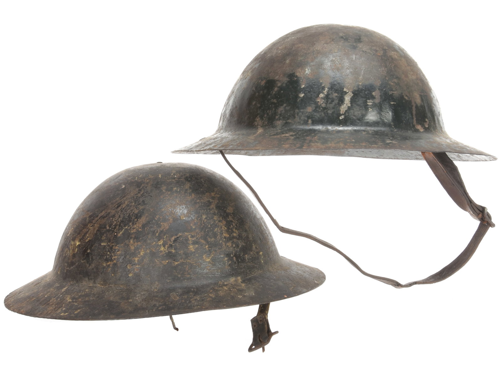 British WWI 'Rimless' Helmet Lot: Two Refitted Helmets: British WWI 'Rimless' Helmet Lot: Two Refitted Helmets Both of these are 'rimless' WWI British helmets, but each have heavily worn black painted finish. One has a commercially altered liner with the t