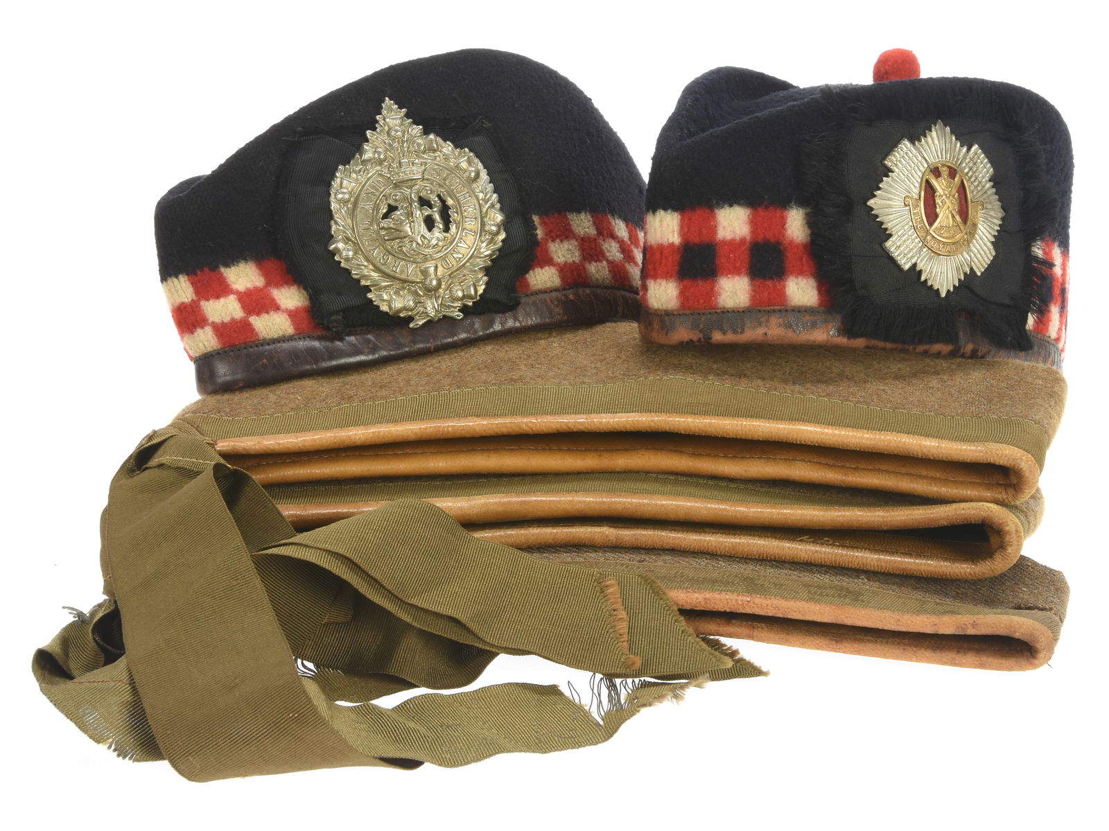 Highland Glengarry Lot: Five Caps: Highland Glengarry Lot: Five Caps First example has a Royal Scots badge, red, white and blue diced band, nice black silk lining with gold embossed tailor label. Has wear along the edges and lacks the