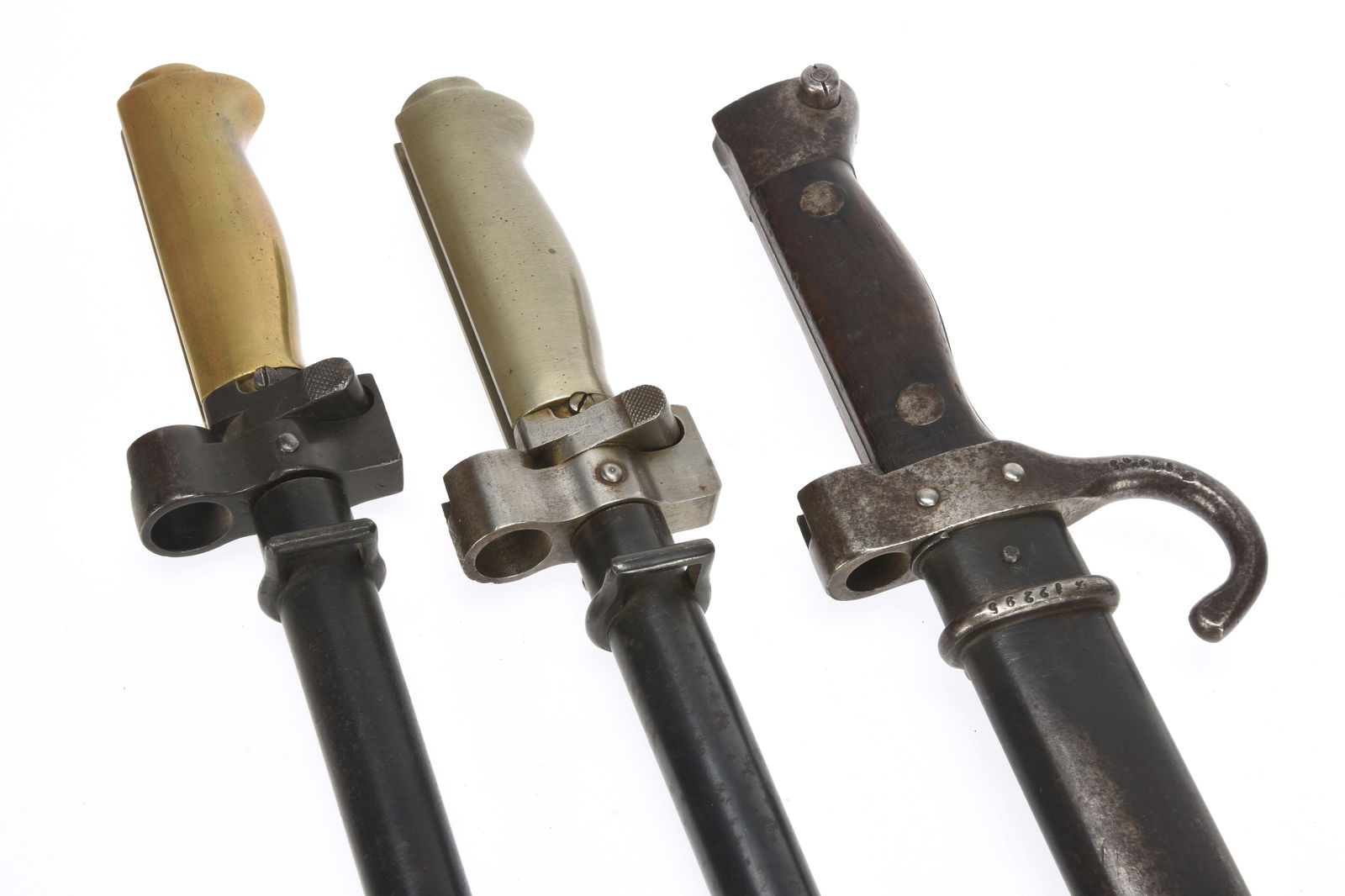 French WWI Bayonets Lot of Three: Two Lebel and One Berthier: French WWI Bayonets Lot of Three: Two Lebel and One Berthier Two Lebel Model 1886/93/15Bayonets, one with white metal alloy hiltand the other with the brass alloy hilt. The brass alloy example has 52c