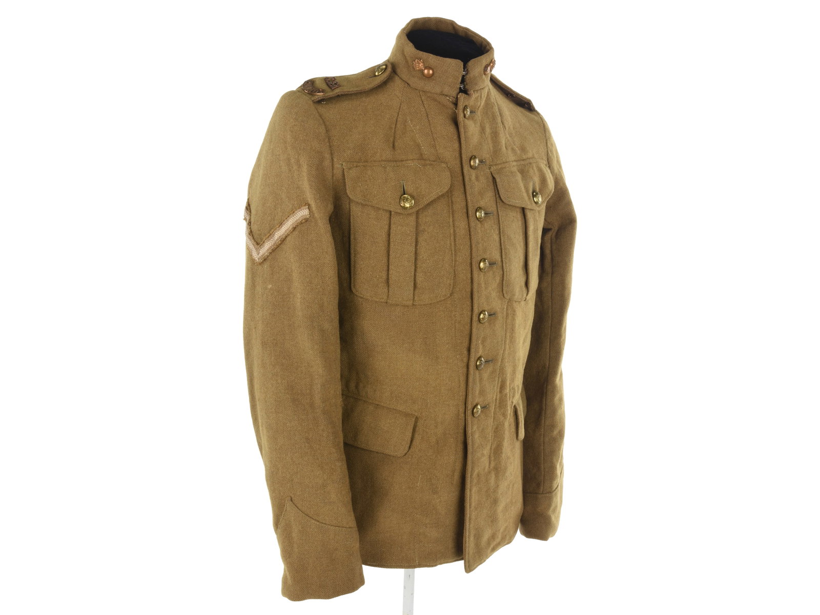 Canadian WWI Field Artillery Lance Corporal's Service Jacket: Canadian WWI Field Artillery Lance Corporal's Service Jacket Canadian Model 1913 seven-button service dress jacket has flaming bomb collar devices, "C.F.A." and "CANADA" shoulder titles, Lance Corpora
