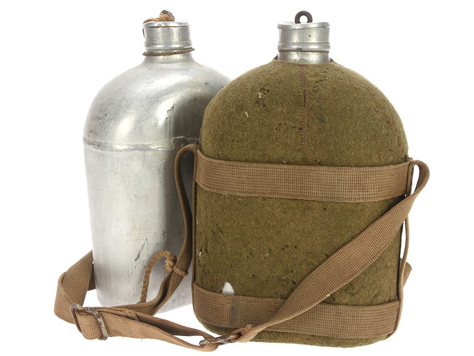 Canadian Pattern WWI Water Bottle Lot: Canadian Pattern WWI Water Bottle Lot Two examples, one with its khaki wool felt covering, web sling and harness. The second is the canteen only, lacking the wool covering and harness. Wool covering o