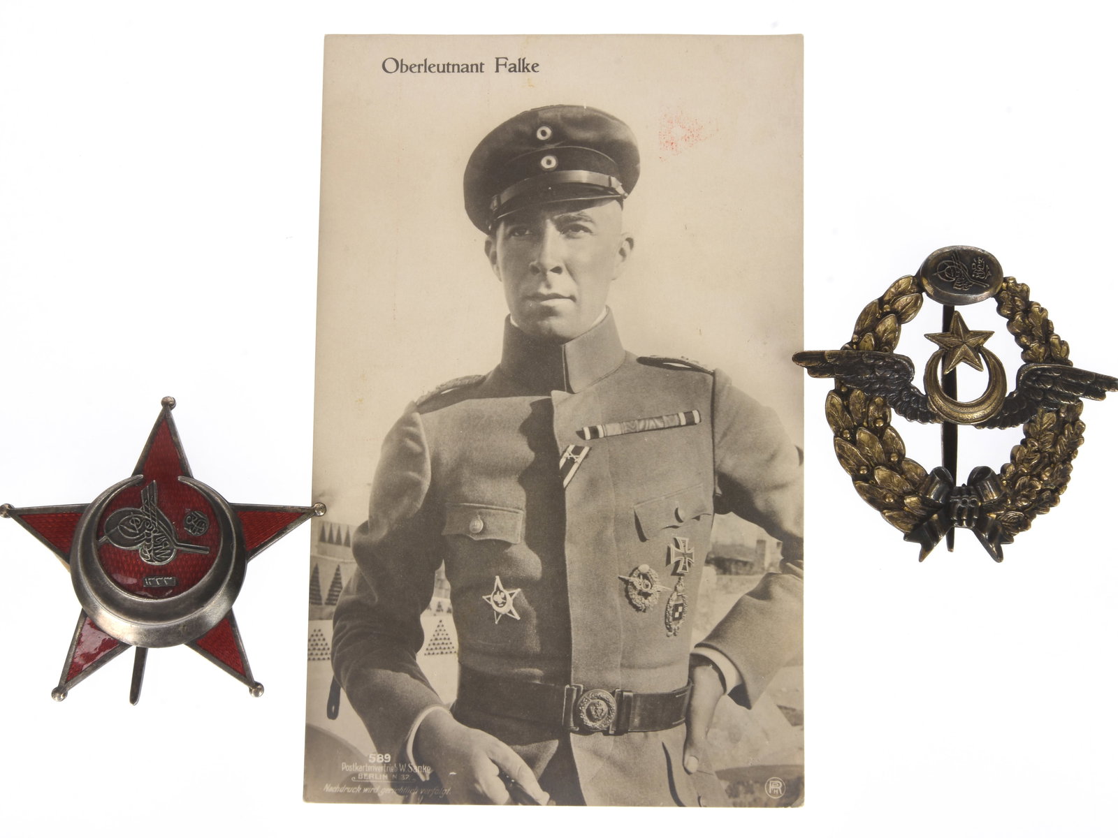 Turkish WWI Gallipoli Star & (reproduction) Pilot Badge: Turkish WWI Gallipoli Star & (reproduction) Pilot Badge Lot was displayed with a commercial photo postcard ofOberleutnant Richard Falke, the famed aviator from Flieger-Abteilung 300 wearing his Prussi