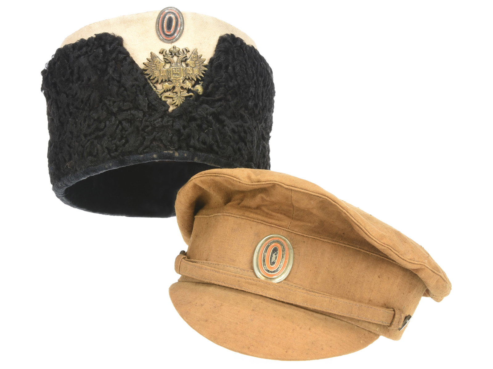 Imperial Russian Display Headgear Lot: Imperial Russian Display Headgear Lot Includes a cossack papakha with diminutive orange and black oval cockade and brass Imperial Russian bicephalic eagle insignia. White crown has yellow lace trim, s