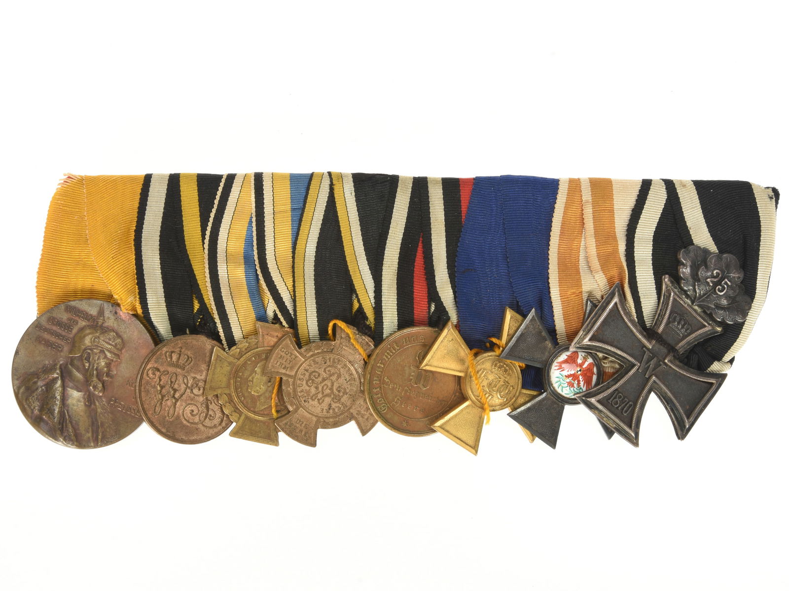 Imperial German Pre-WWI period 8-place Medal Bar: Imperial German Pre-WWI period 8-place Medal Bar. Imperial German pre-World War I medal bar presenting 1870 Iron Cross 2nd class with 25 Year anniversary oak leaves, Prussian Order of the Red Eagle 4t