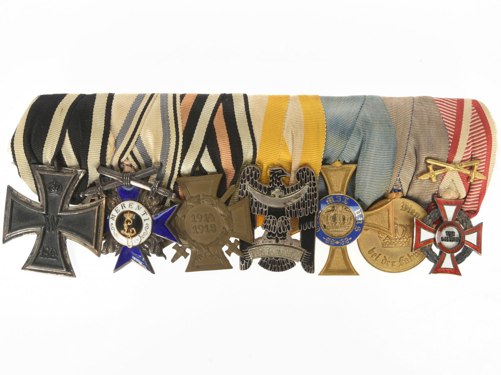 Imperial German WWI period 7-place Medal Bar: Imperial German WWI period 7-place Medal Bar. Imperial German World War I medal bar presenting 1914 Iron Cross 2nd class, Bavarian Merit Cross 1st class with swords (Type 1), Honour Cross of the World