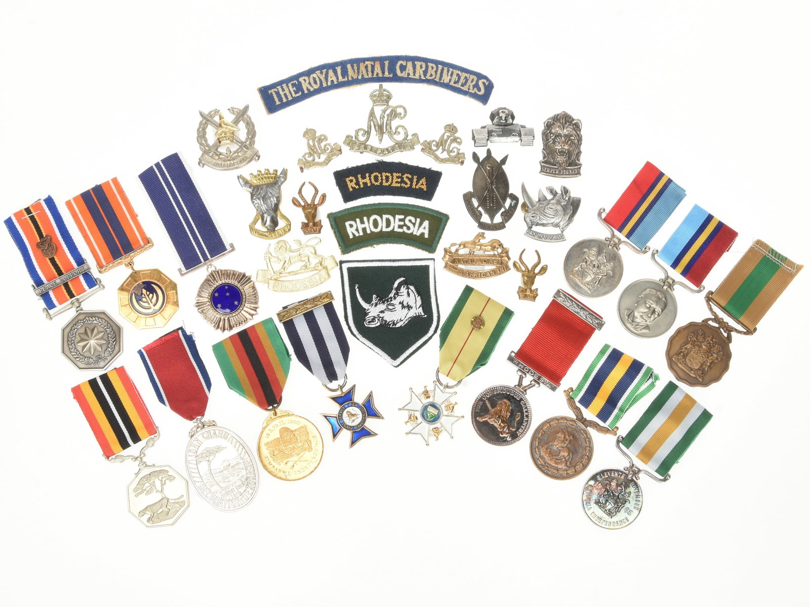 African (South Africa, Rhodesia, Zimbabwe and Others) Medals and Insignia.: African (South Africa, Rhodesia, Zimbabwe and Others) Medals and Insignia. Large grouping of African (South Africa, Rhodesia, Zimbabwe and Others) Medals and Insignia including: 1.) South African Sout