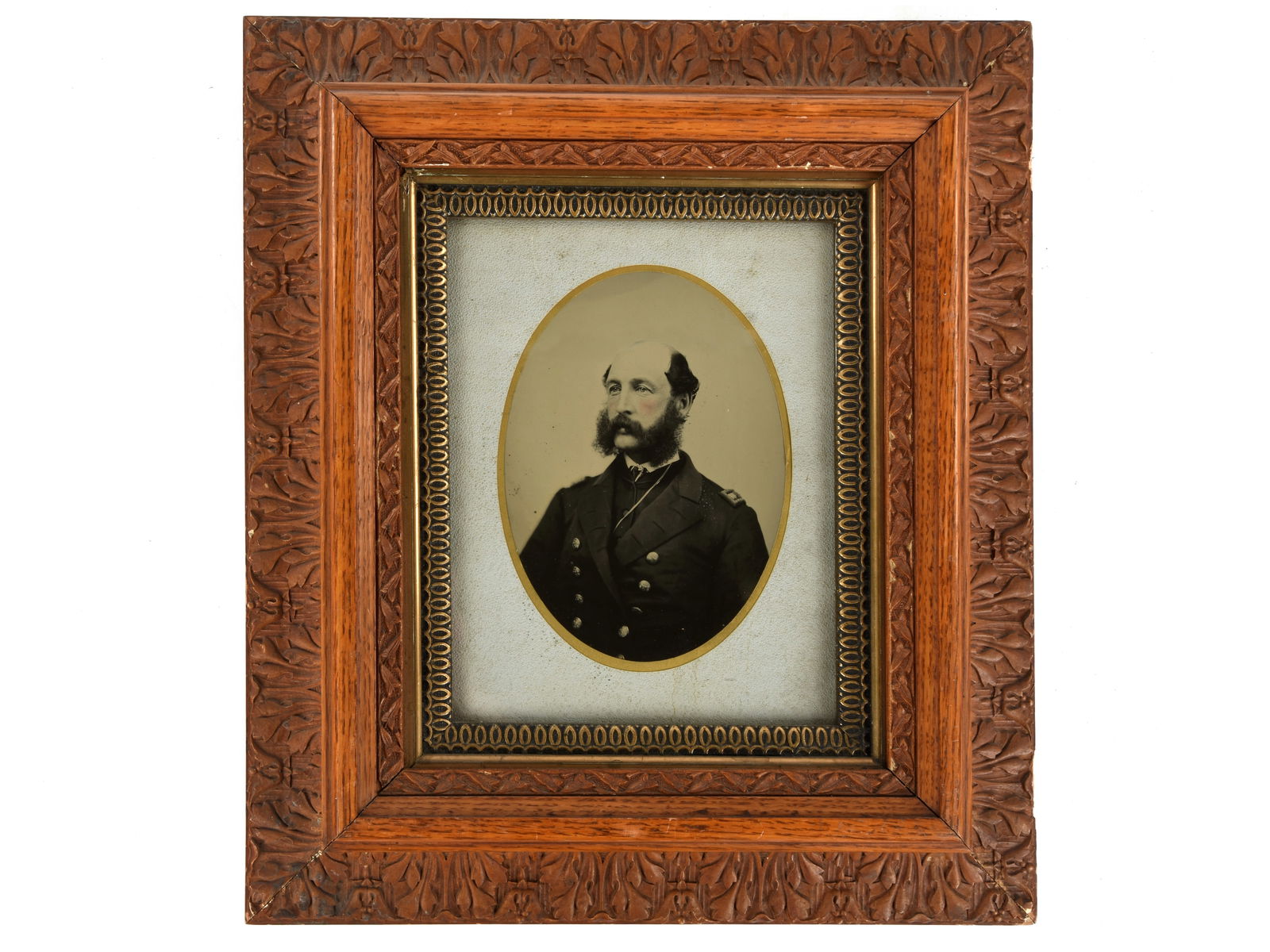 Full Plate Tintype of a US Navy Lieutenant - Dunham Estate, New York: Full Plate Tintype of a US Navy Lieutenant Full plate framed tintype of a seated US Navy officer in frock coat with shoulder straps. It is housed in a combination of two attractive older frames with a