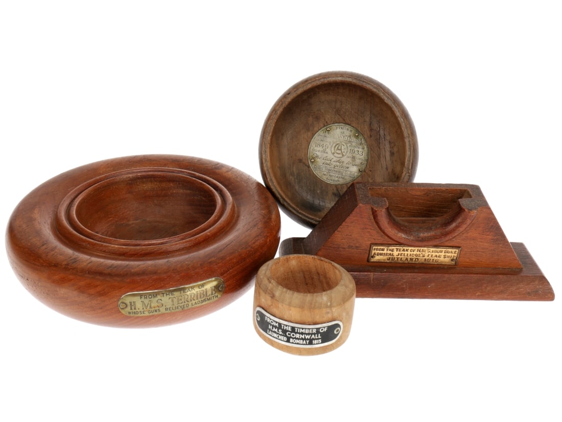 Souvenir Items Made from the Wood of British Ships: Souvenir Items Made from the Wood of British Ships. From the teak of HMS Iron Duke, Admiral Jelicoe's Flag Ship, Jutland 1916. Stand for a small clock maybe? Base is felt covered and measures 15.5cm x