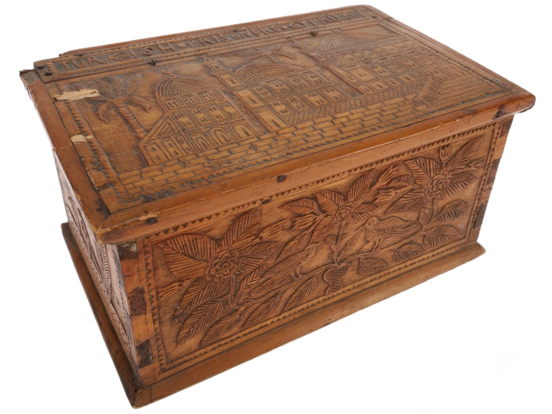 Turkish Prisoner of War Wooden Box, Cyprus: Turkish Prisoner of War Wooden Box, Cyprus. Wooden box with wire hinges. Lid has carvings of buildings, front has birds perching on vines, right side has a peacock, back has a man and his dog hunting 