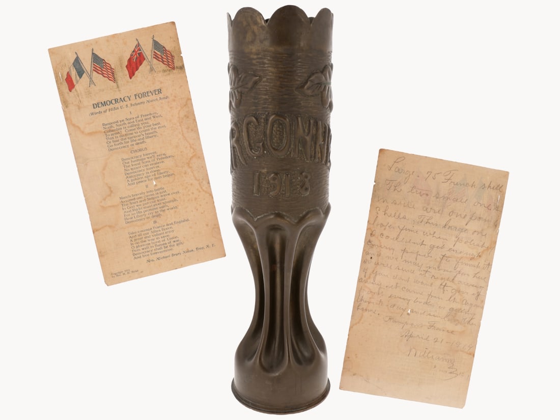 WWI US Trench Art Shell: ARGONNE With 27th Division Soldier's Letter Home: WWI US Trench Art Shell: ARGONNE With Letter Home. 75mm shell casing stands 30.5cm tall with drawn, fluted base, crenelated top edge, and raised relief "ARGONNE 1918" inscription with floral motif aga