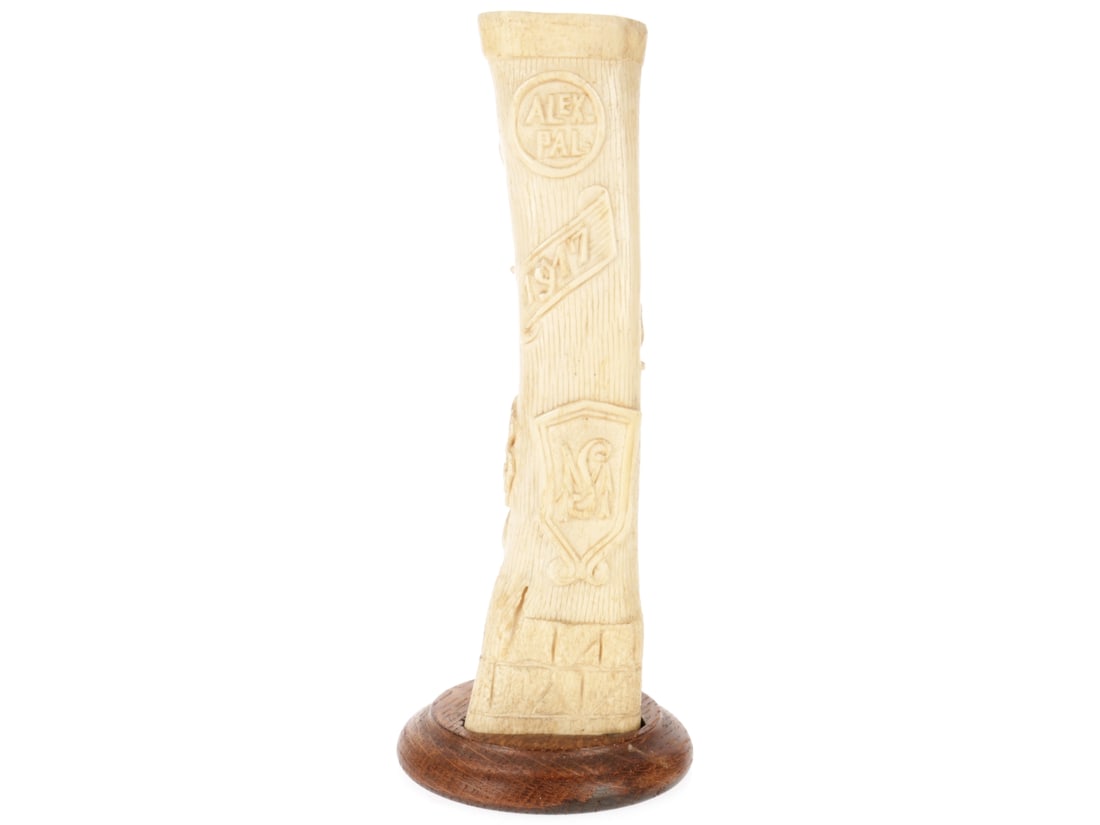 Floral Motif Detained Enemy Alien Prison Camp Bone Art: Floral Motif Detained Enemy Alien Prison Camp Bone Art. ~4cm tall with a well-rendered rose floral motif on one side, name, monogram, and date "1917" on the other, with fitted wood base. Remains in ve