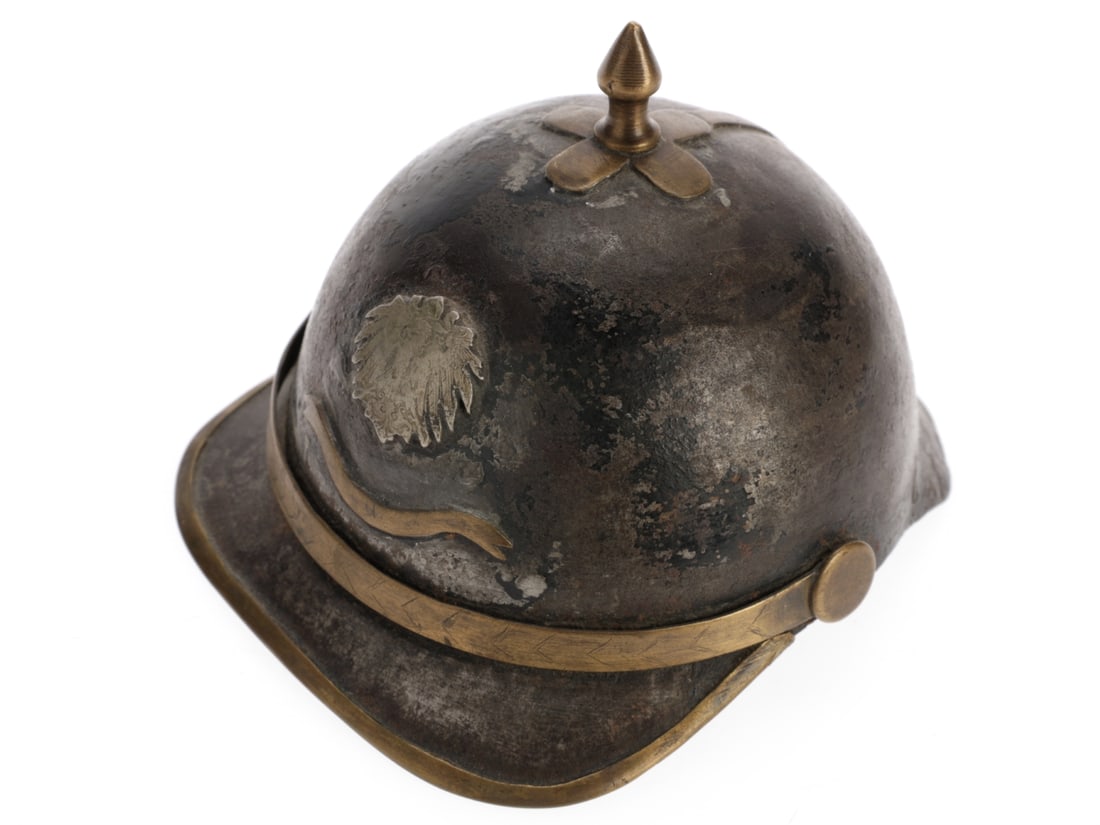 Handmade Miniature German Pickelhaube with Liner: Handmade Miniature German Pickelhaube with Liner Handheld German pickelhaube made from a single piece of shaped sheet steel has a brass cruciform spike, brass peak mount and rear spine, brass chinstra