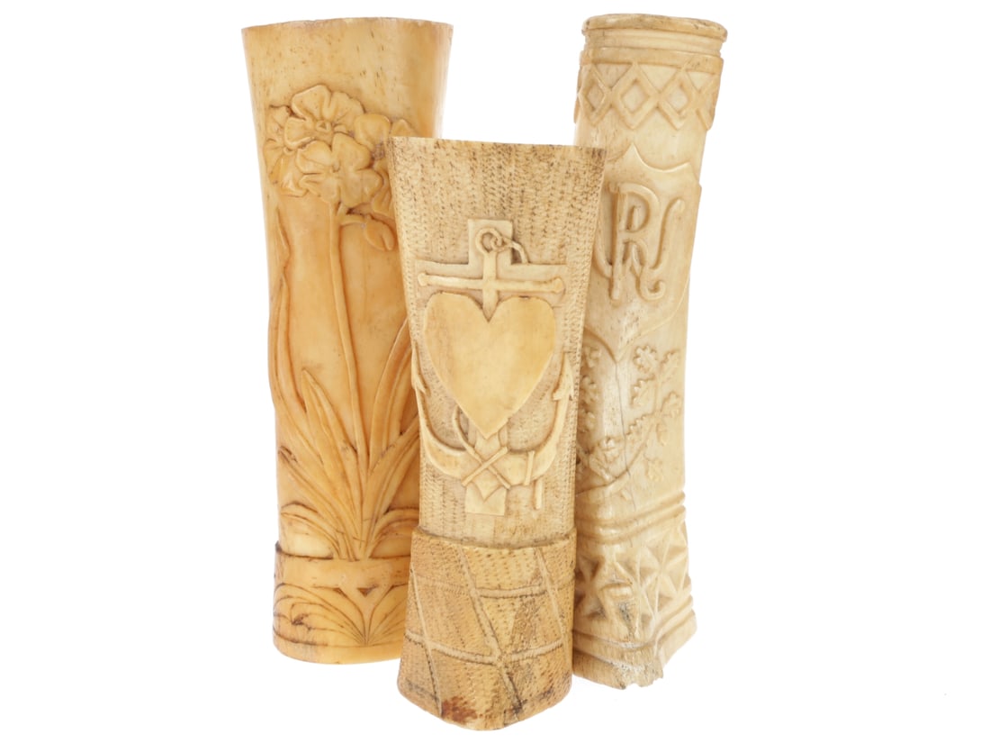 Detained Enemy Alien and German Prisoner of War WWI Prison Camp Bone Art: Lot of Three: Detained Enemy Alien and German Prisoner of War WWI Prison Camp Bone Art: Lot of Three. First example is 19cm tall, with "Lancaster 1914/5" in raised relief on one side; floral wreath with monogram "W
