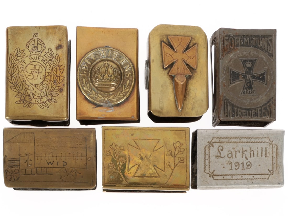 Lot of WWI Match Safes: Lot of WWI Match Safes. 1. Brass with French coin, Belgian coin, and copper Iron Cross. 2. Folded sheet metal with nicely embossed center showing a German helmet, pack and rifles surrounded by flags