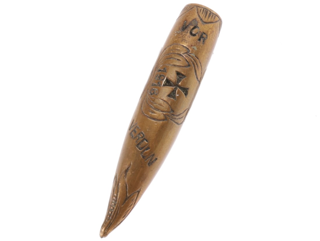 WWI German Themed Verdun Bullet Brooch: WWI German Themed Verdun Bullet Brooch 40mm long bullet, caliber unknown for sure but a partial stamp on the base of the bullet looks French. One side is smothed to a flat surface fro the spring pin c