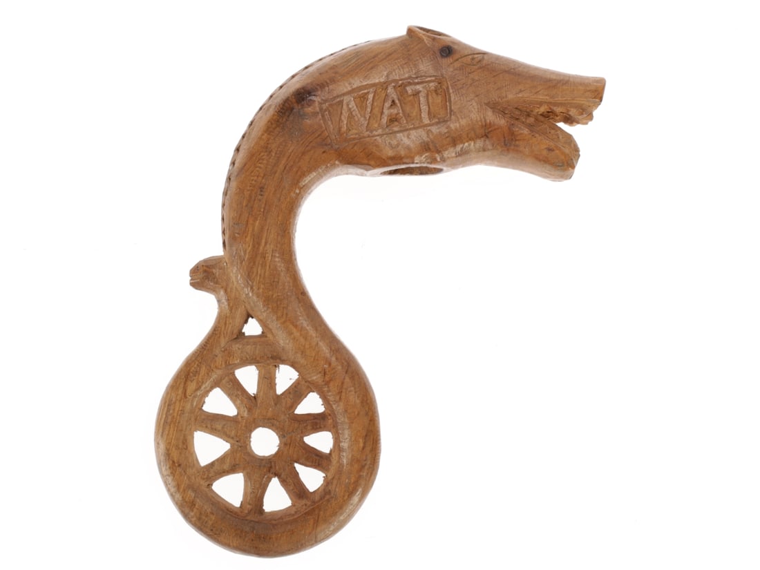 WWI Soldier's Trench Art Wood Carving - Water Horse 1917: WWI Soldier's Trench Art Wood Carving - Water Horse 1917 Whimsical carving of a hybrid creature with small, laid back ears, a blunt snout and a scaled crest is coiled around a nine spoked wheel, engra
