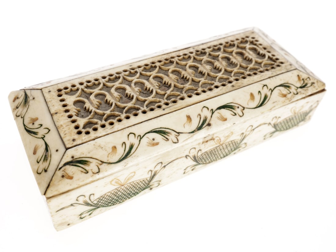 Scrimshaw Bone Box: Scrimshaw Bone Box 14 x 5.5 x 3.5 cm box made of wood and thin slabs of bone. The base is wood and the walls are very thin strips of bone supported in the corners by wooden posts. The lid is comparati