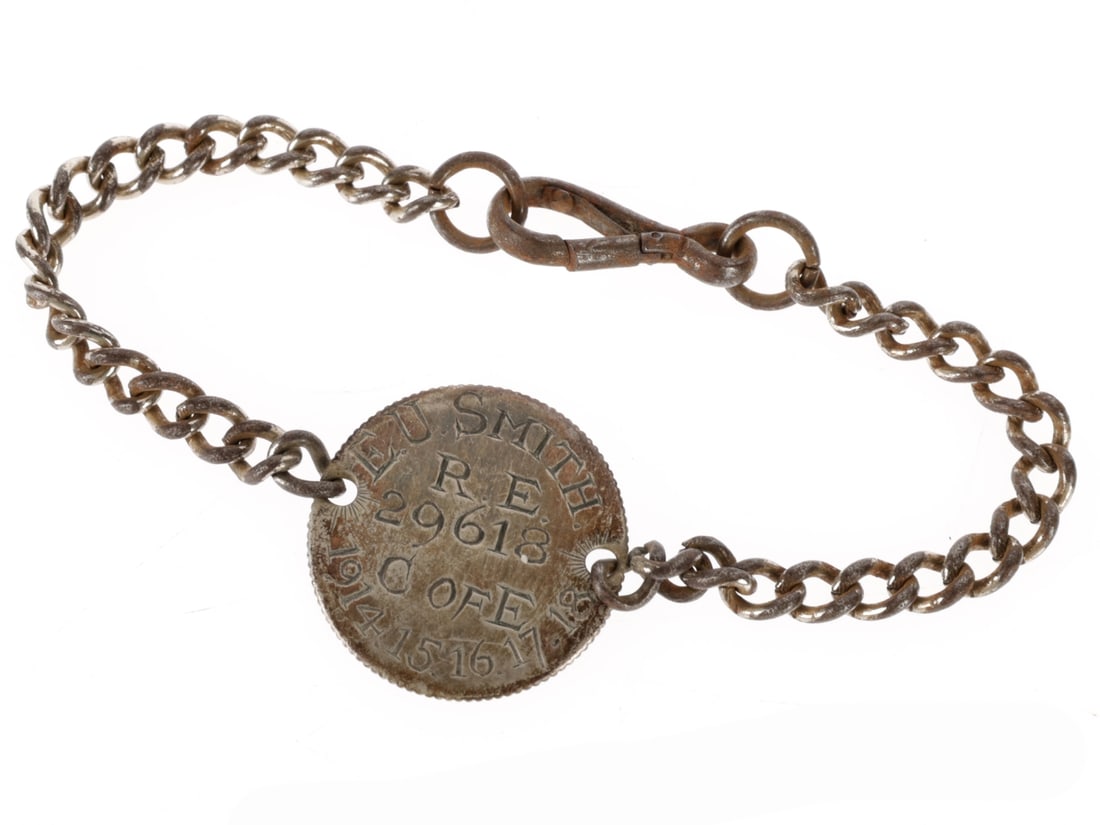 WWI British Royal Engineers ID Bracelet: WWI British Royal Engineers ID Bracelet 1917 French 1 Franc coin is 23mm in diameter. Th reverse has been rubbed smooth and re-engraved E.U. SMITH / R.E / 29618 / C OF E / 1915-15-16-17-18. Complete w