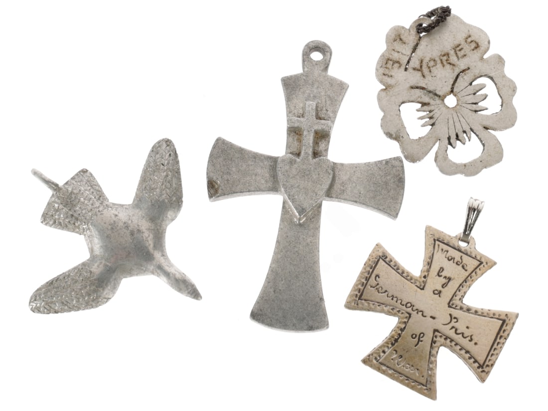 WWI Trench Art Pendant Lot: WWI Trench Art Pendant Lot Four pendants made of aluminum: 1) One piece cross with sacred heart, 40 x 25mm with suspension loop, reverse engraved "Guerre 1914-15". There is some material loos on the l