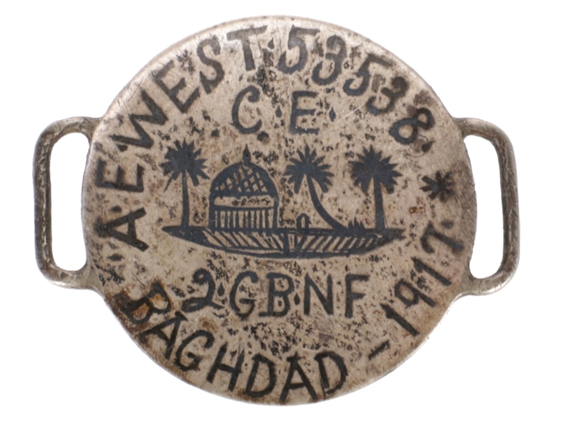 WWI Northumberland Fusiliers ID Bracelet / Love Token: WWI Northumberland Fusiliers ID Bracelet / Love Token 27.8mm Persian coin with smoothed obverse has been re-engraved A.E.WEST 53538 / C.E. / 2GBNF / BAGHDAD - 1917 with a scene of a mosque and palm tr