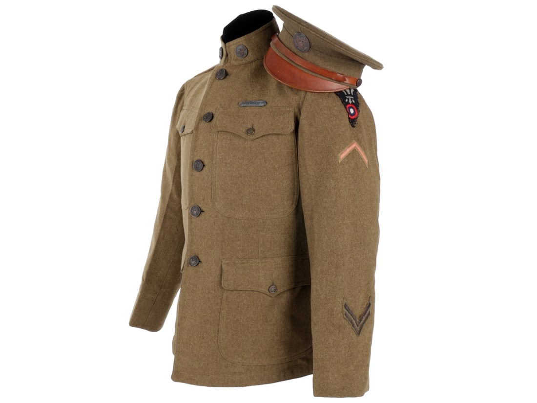 District of Paris US Army Aviation NCO's Coat & Enlisted Visor Cap: District of Paris US Army Aviation NCO's Coat & Enlisted Visor Cap. Enlisted issue olive drab wool M1912 coat has "US" and Aviation collar discs, Sergeant First Class chevron on the right sleeve, Dist