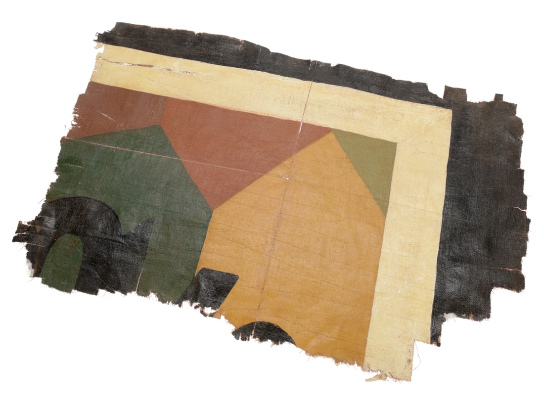 A Piece of WWI German Aircraft Fabric with Partial Markings: A Piece of WWI German Aircraft Fabric with Partial Markings. An irregular 28cm x 17cm section of doped linen fabric has painted camouflage pattern with black and white border on one side and a hint of